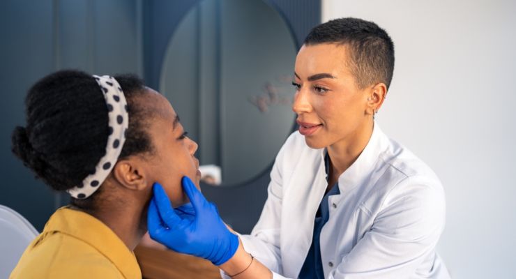 Young,Woman,With,Dark,Skin,Tone,At,Dermatology,Check,Up