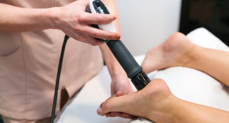 Practitioner,Using,Shockwave,Therapy,On,Patient's,Foot,For,Plantar,Fasciitis