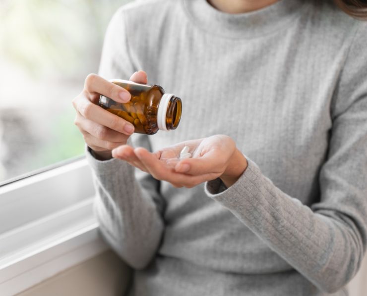 Healthcare,Harmony:,Close-up,Hands,Holding,Medication,And,Water,Glass,For